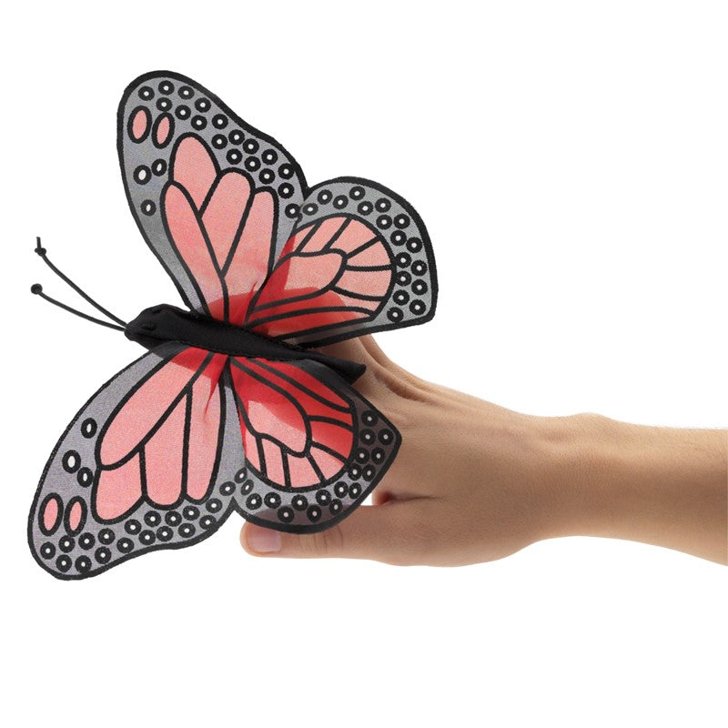 Monarch Butterfly Finger Puppet with sheer silk-screened wings and stretchy nylon body on a hand.