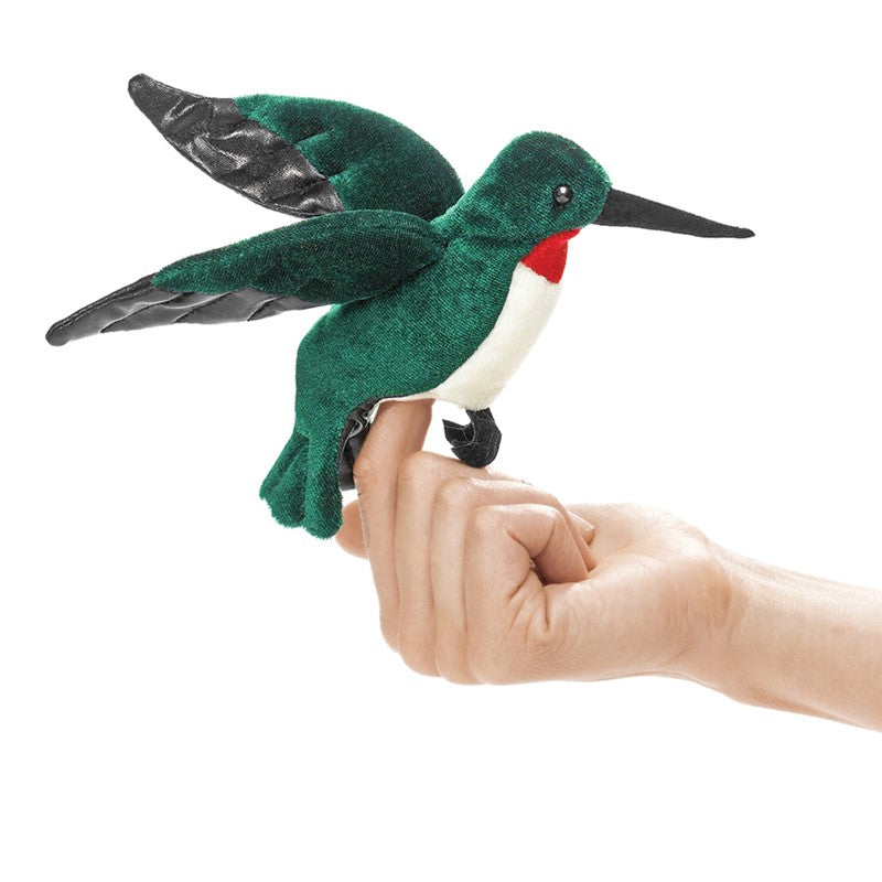 Hummingbird Finger Puppet with soft emerald green body and ruby throat, perched on a hand for imaginative play.