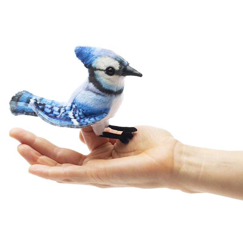 Blue Jay Finger Puppet shown perched on a hand, featuring bright blue, black, and white colors with a perky crest.