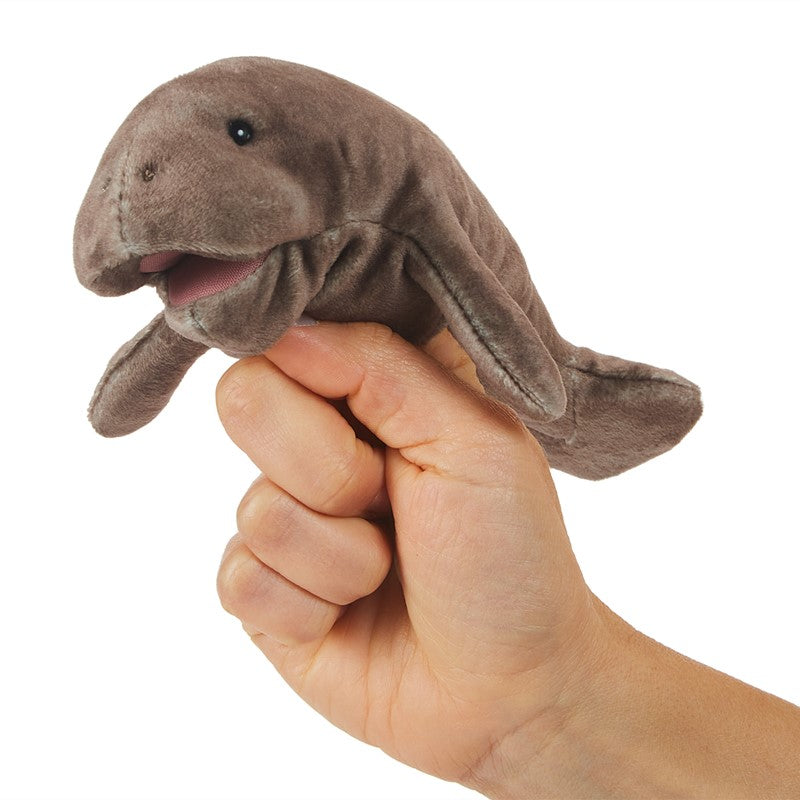Hand holding a brown Manatee Finger Puppet with a movable mouth, perfect for ages 3 and up.