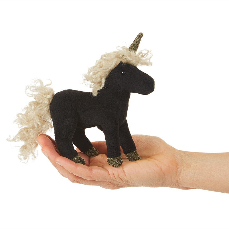 Black Unicorn Finger Puppet shown in hand, featuring black body, curly white mane, and glittery horn and hooves.