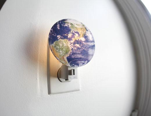 Earth Nightlight showing realistic 3D printed earth globe illuminating a hallway with manual on/off switch and 7-watt bulb.