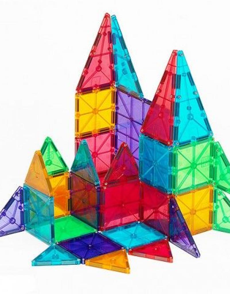 Brightly colored translucent shapes assembled into a creative structure using Magnatiles Clear 32pc set for imaginative play.