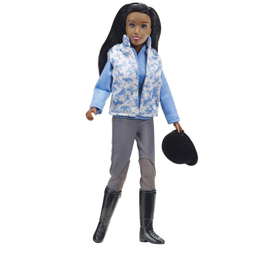 Schooling Rider doll dressed in breeches, vest, tall boots, holding helmet, ready for horse schooling activities.