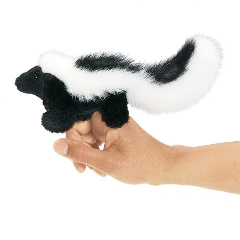 Skunk Finger Puppet shown on hand, featuring soft black and white fur and a long fluffy tail, perfect for ages 3 and up.
