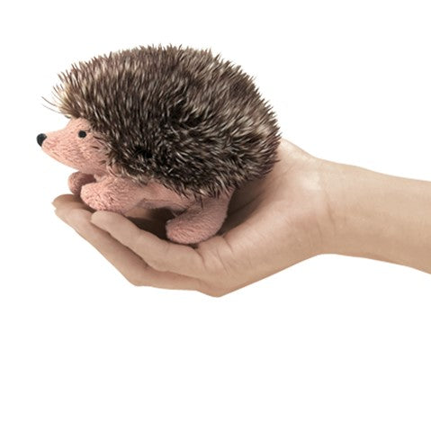 Hedgehog Finger Puppet shown resting on an open hand, soft plush hedgehog toy with realistic spiky fur details.