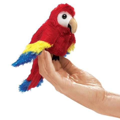 Scarlet Macaw Finger Puppet in bright red, yellow, and blue perched on a person’s hand, perfect for kids ages 3 and up.