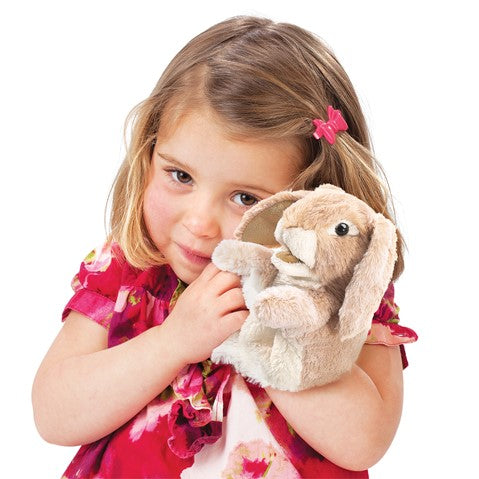 Young girl cuddling the Lop Rabbit Little Hand Puppet with soft angora fur and movable mouth and forelegs.