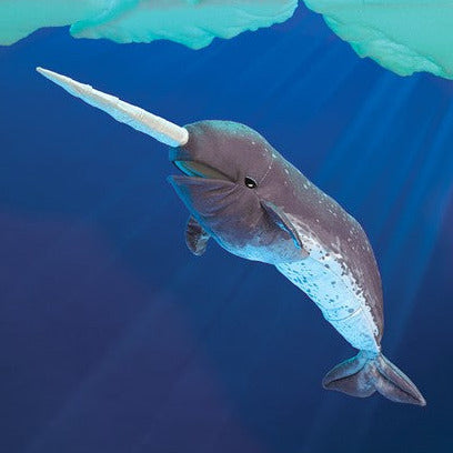 Narwhal Puppet with soft mottle-patterned skin and spiral tusk shown swimming underwater in a friendly pose.