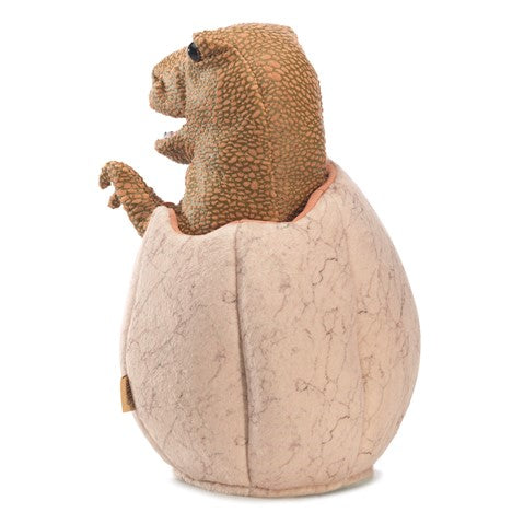 Dino in Egg Puppet showing a movable T-Rex emerging from a soft, plush cracked egg for imaginative play.