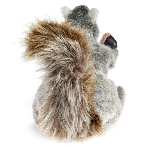 Gray Squirrel Puppet with soft fur, fluffy tail, moveable mouth, and holding an acorn, shown from the back side.
