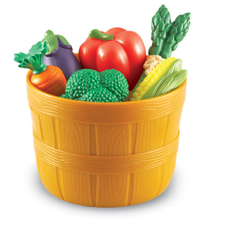 Bushel of Veggies toy basket filled with colorful plastic vegetables including broccoli, corn, carrot, and peppers.