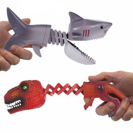 Shark vs Dino Chompers toy with extended jaws, held in hands, showing shark and dinosaur chomping action.
