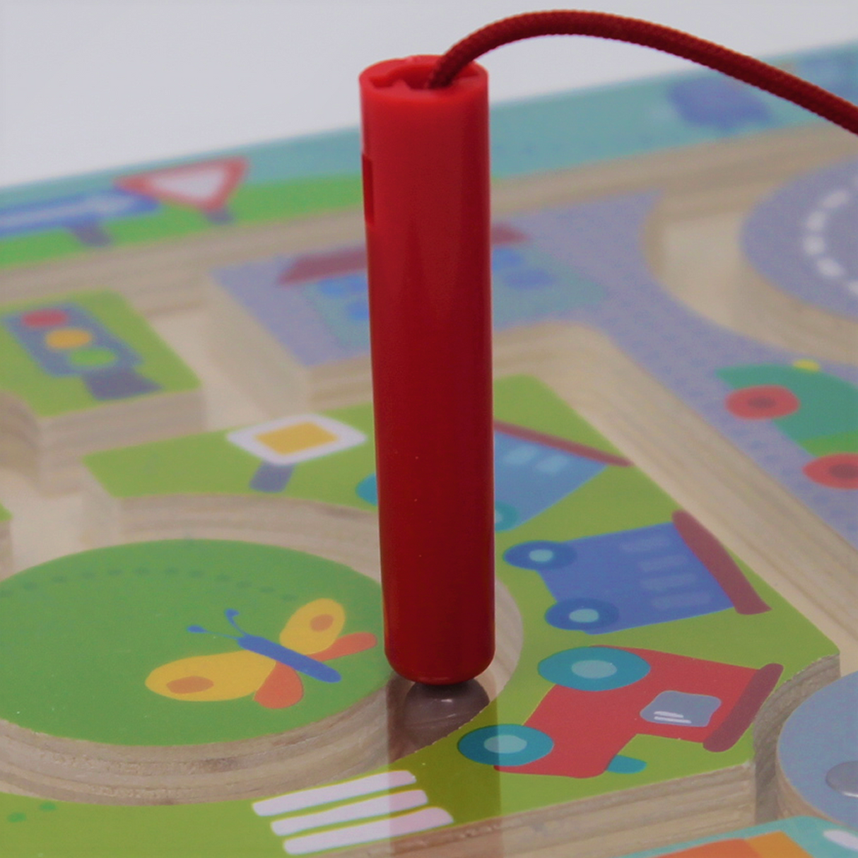 Magnetic Puzzle Game | Town Maze with red magnetic wand guiding colorful balls through city tracks and roadblocks.