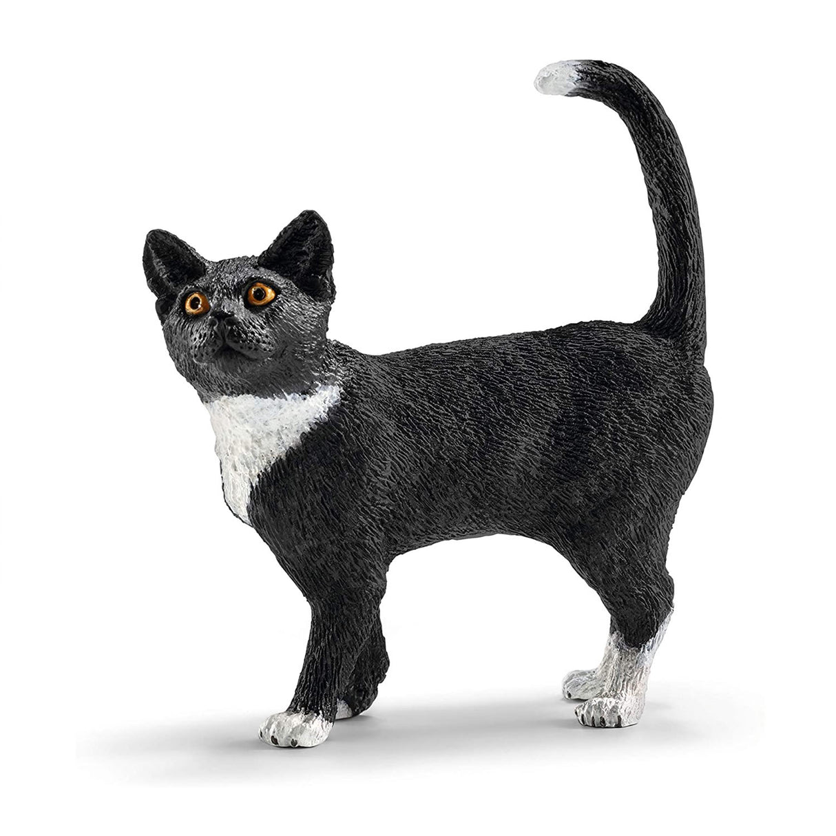 Cat Standing figurine showing a black and white cat with alert eyes and raised tail in a graceful posture.