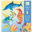 Origami Sea Creatures kit showcasing colorful folded paper dolphin, seahorse, fish, and shell with instructions included.