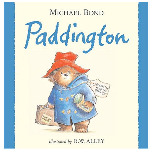 Cover of Paddington featuring the bear in a blue coat and red hat holding a suitcase and marmalade jar.