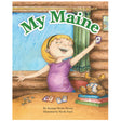 My Maine book cover shows a joyful girl playing cards with a stuffed moose in a cozy cabin setting.