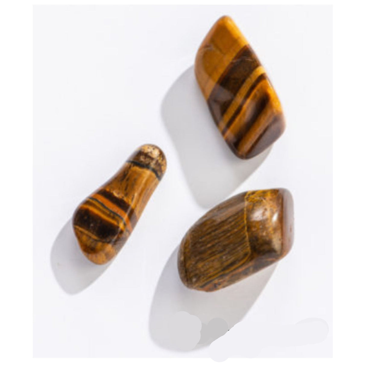 Rock | Tiger Eye assorted tumbled stones in varied shapes and sizes with unique brown and gold bands on white background.