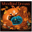 Woodland Dreams book cover shows a sleeping fox curled with autumn leaves around a child walking a dog in the woods.