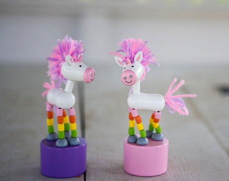 ThumbToy Unicorn push puppets with colorful legs and pink manes on purple and pink bases, fun toy for kids ages 3+