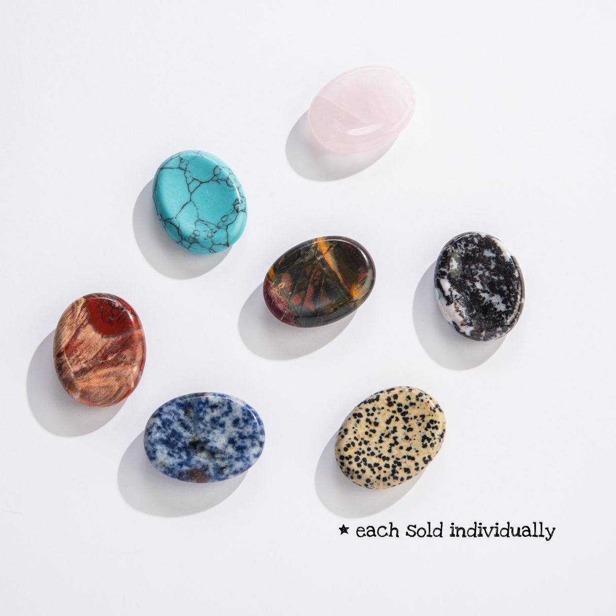 Worry Stone polished flat stones in various natural colors with a slight indention for rubbing, sold individually.