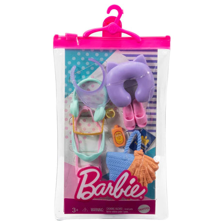 Barbie Fashion Accessories with travel-themed hats, bags, shoes, and neck pillow in a pink hanging case.