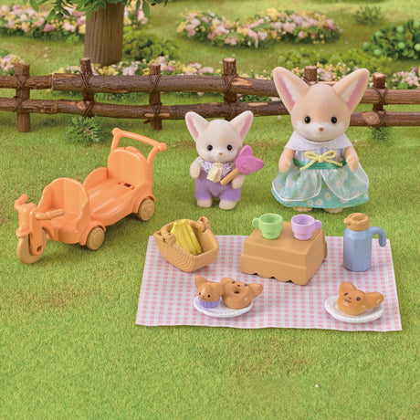 Fennec Fox Sunny Picnic Set with poseable dolls, orange tricycle wagon, checkered blanket, basket, and picnic accessories.