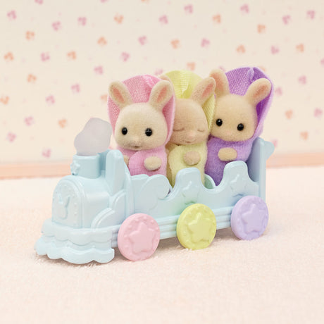 Triplets Bathtime Set with three Milk Rabbit triplets riding a pastel-colored toy pushcart for bath fun