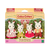 Chocolate Rabbit Family toy set with four rabbit figures in colorful clothing and a cottage playhouse backdrop