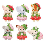 Six tiny animal toys dressed in strawberry-themed outfits with green leaf hats and red or pink skirts
