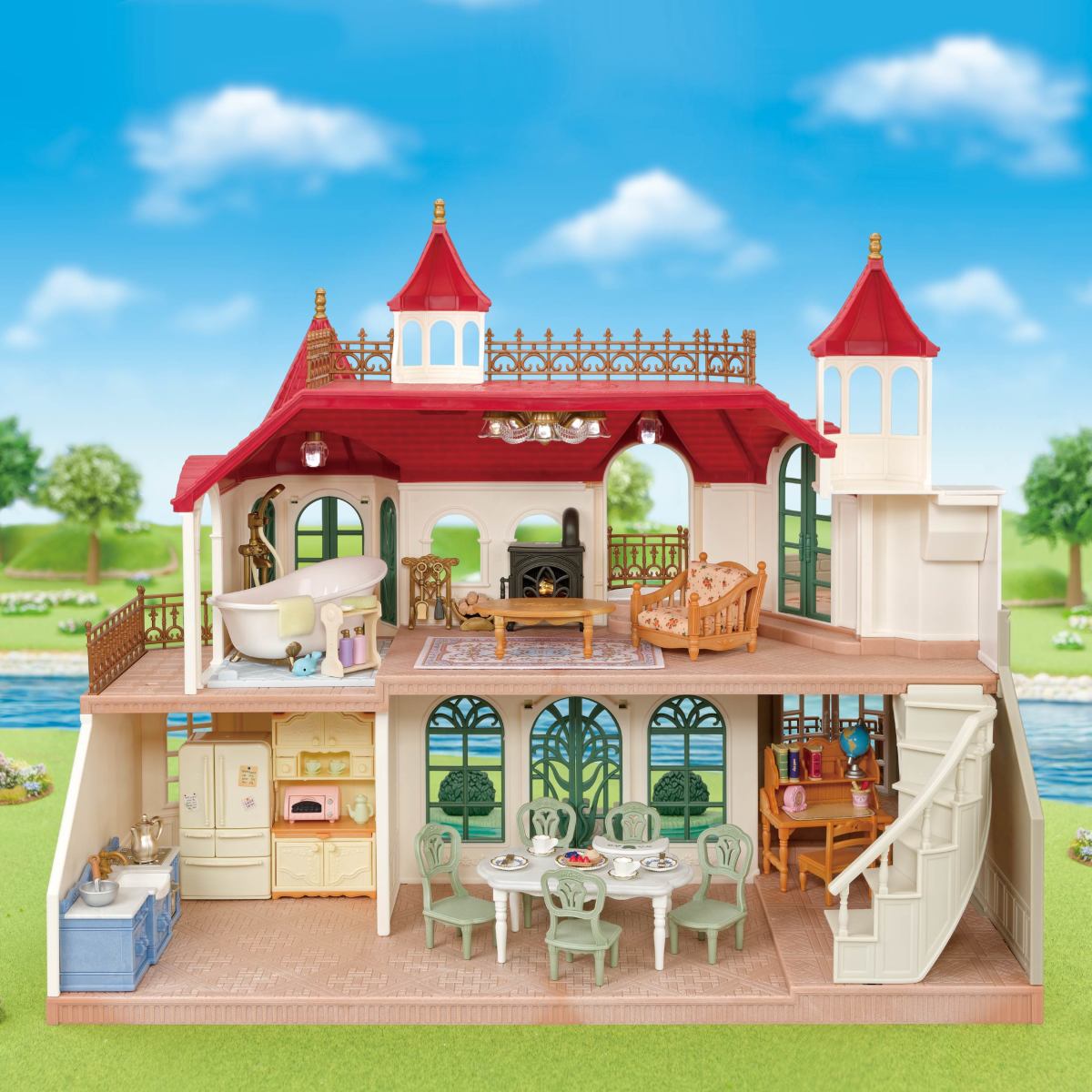 Red Roof Riverside Manor dollhouse with red turrets elegant rooms furnishings and a riverside backdrop