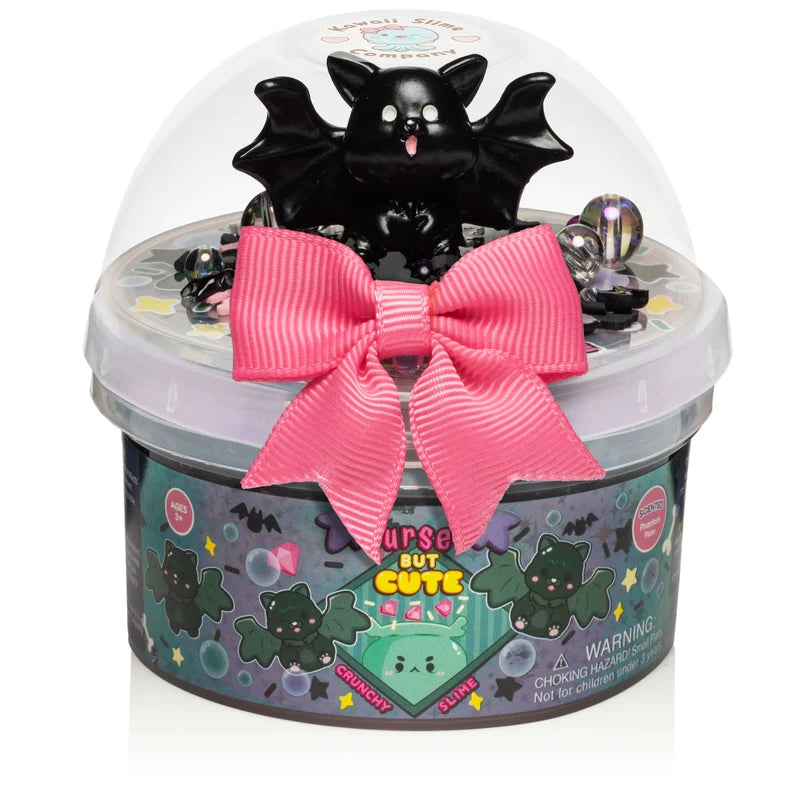 Cursed But Cute Crunchy Slime container with black cat topper and bright pink bow