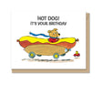 Birthday card featuring a dog driving a hot dog car with the message Hot Dog! It’s Your Birthday