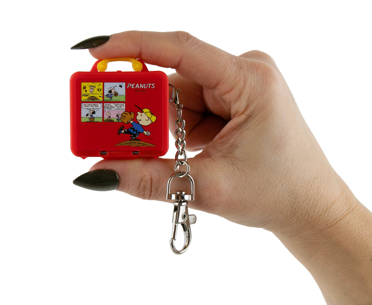 World's Smallest Peanuts Lunch Box tiny red lunch box keychain held in hand