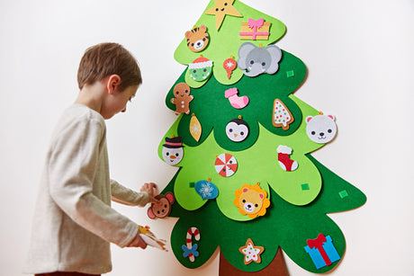 Decorate Your Own Christmas Tree with a child hanging colorful ornaments