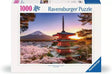 Scenic puzzle image featuring a red pagoda with cherry blossoms and Mount Fuji at sunset sky background