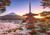 Traditional red Japanese pagoda surrounded by cherry blossoms with Mount Fuji in the glowing sunset background