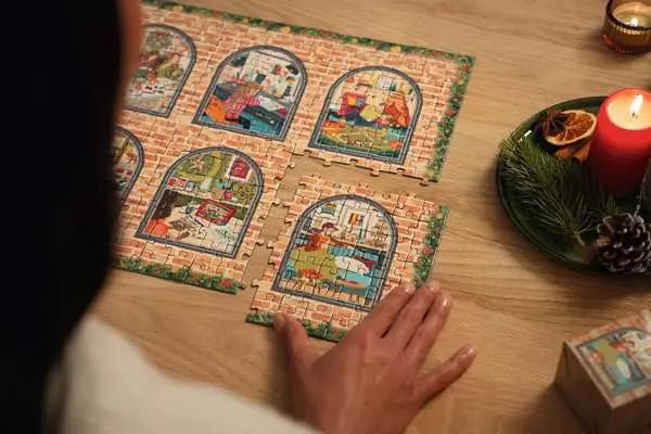 Puzzle Advent Calendar 2026 with colorful illustrated puzzle panels being assembled on a table