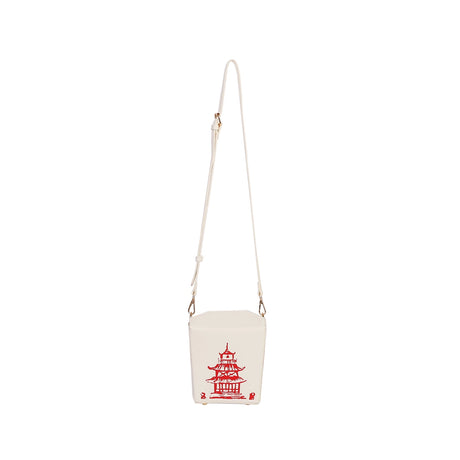 Handbag | Takeout Box crossbody bag shaped like a white takeout container with red pagoda print and adjustable strap.