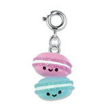 Macaron Buddies Charm features two smiling 3D pink and blue macarons with glitter and enamel details on a silver clasp.