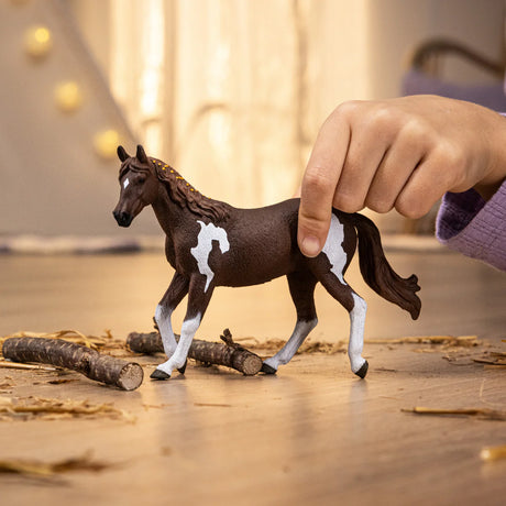 Paint Horse Mare figurine with chocolate brown coat, white legs, and white markings on flanks and forehead.