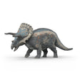 Triceratops dinosaur toy with textured gray body and colorful frill