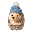 Plush hedgehog toy wearing a cozy blue knit winter hat with a white pompom on top, soft and cuddly design.