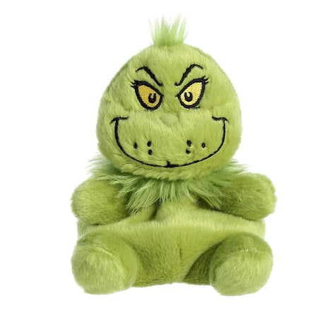 Soft green plush toy of a grumpy character with mischievous eyes and fuzzy texture sitting upright