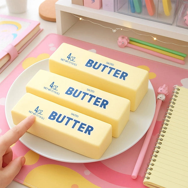 Butter Stick Squishy butter shaped sensory toys arranged on a white plate