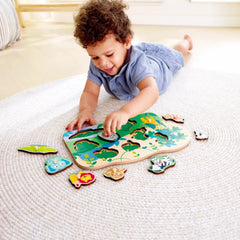 Wild Animals Peg Puzzle with child placing colorful animal pieces on a wooden board