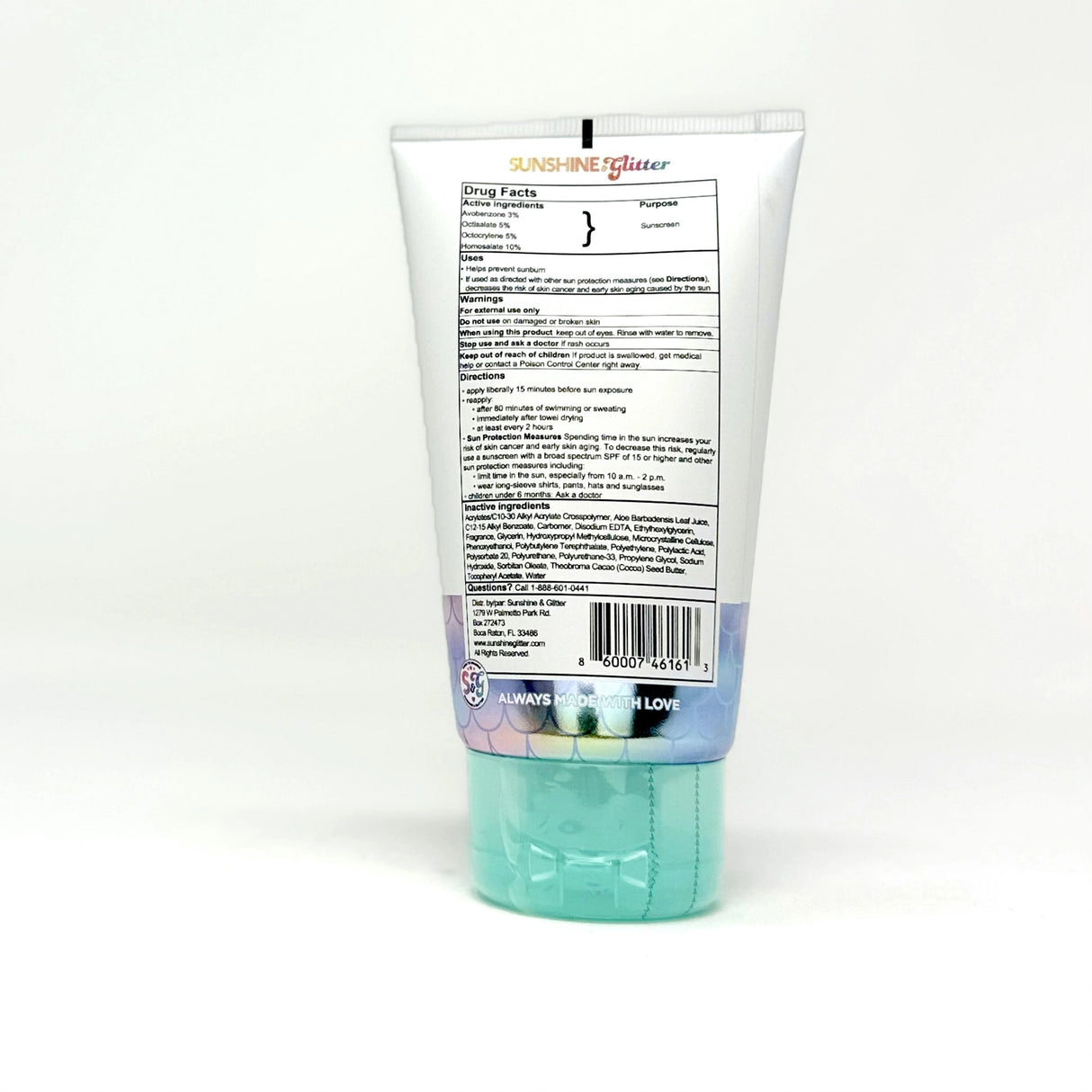 Back view of a sunscreen tube with active ingredients and application instructions on a white background