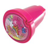 Depiction of Rainbow Sticker Stamper, which looks like a small pink tube. On the top of the tube it says "you shine" and has cartoon drawings of fantasy items. For ages 3 and up.