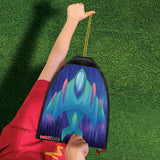 Child holding a colorful rubber band rocket kite ready to launch on a sunny day over green grass